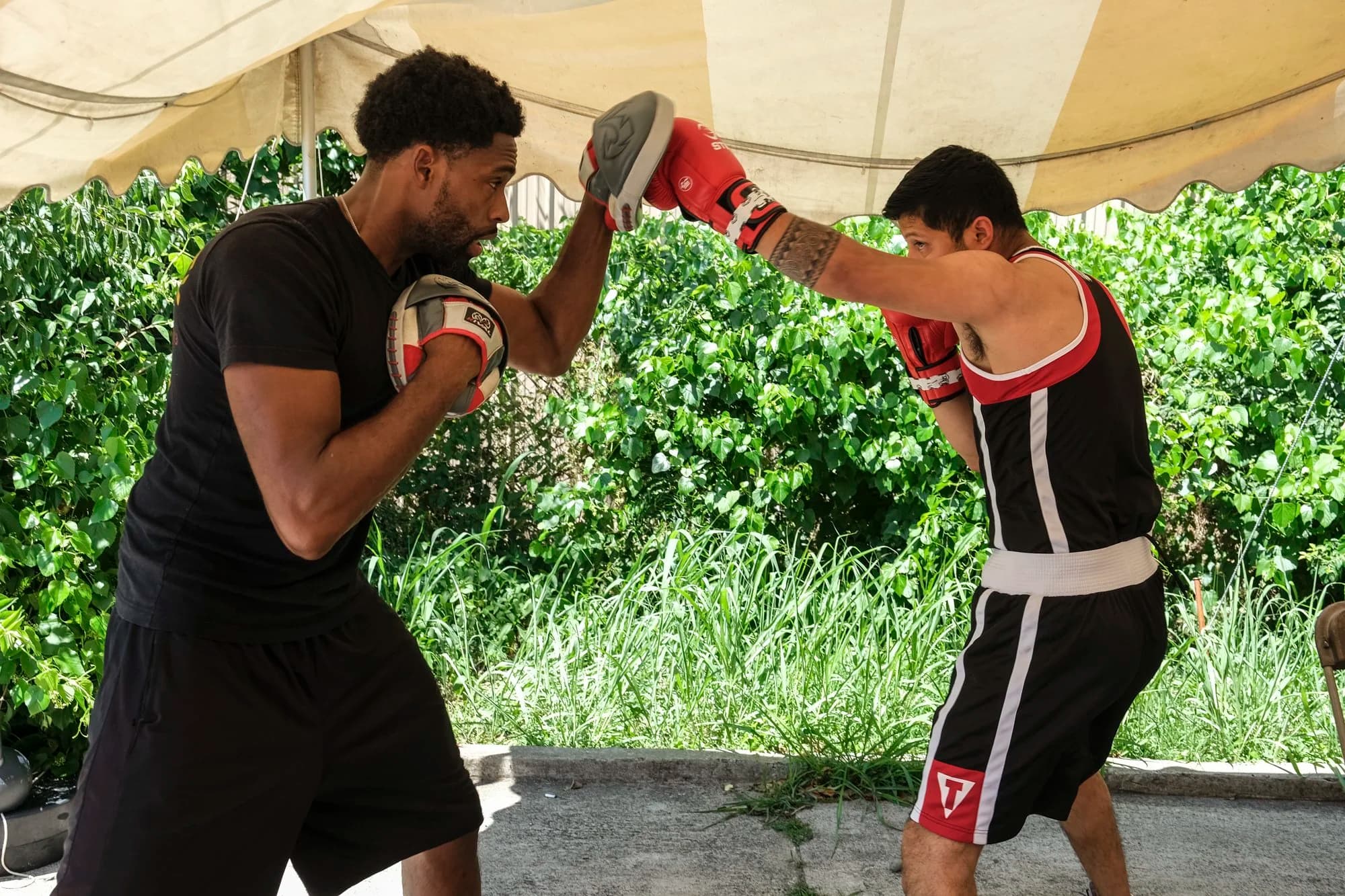 Damany Berkley, Coach at Music City Boxing, holding mitts